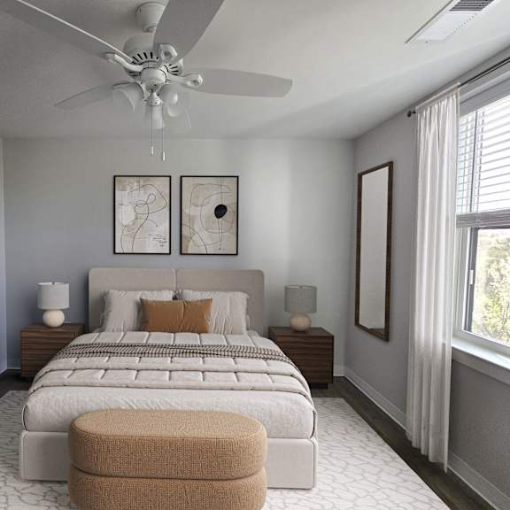a bedroom with a large bed and a ceiling fan.