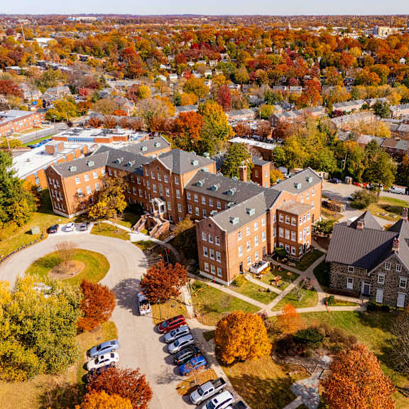 an aerial view of a campus with a large building in the center.