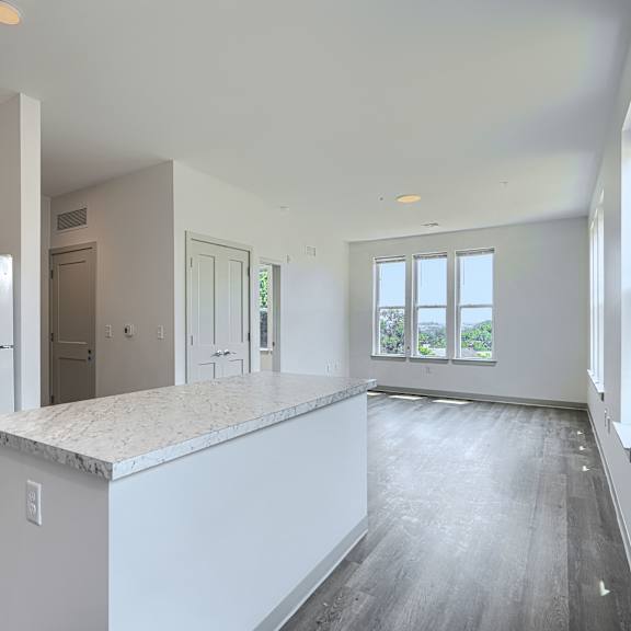 a kitchen with white appliances and cabinets is shown.
