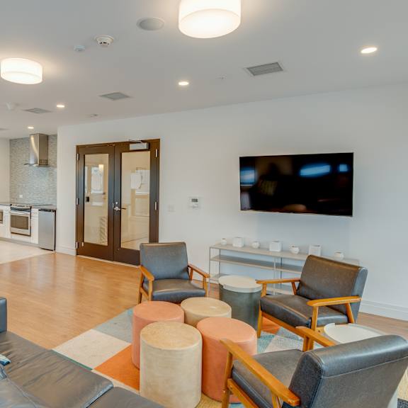 community room with tv and communal kitchen