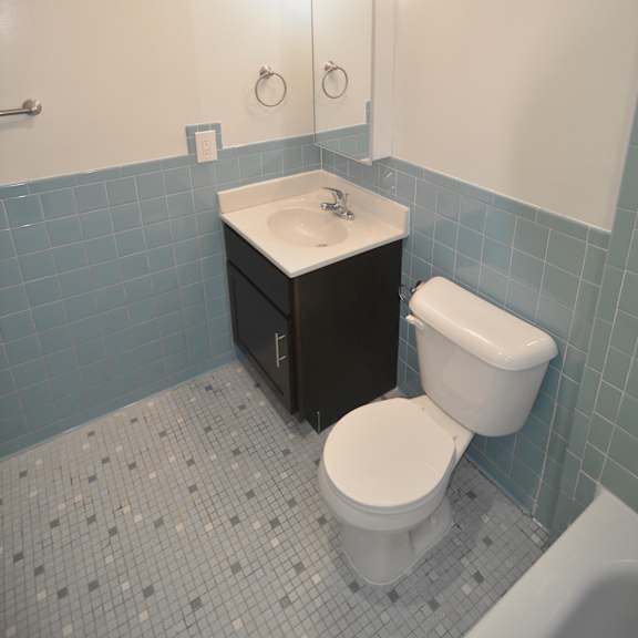 a bathroom with a toilet sink and bathtub