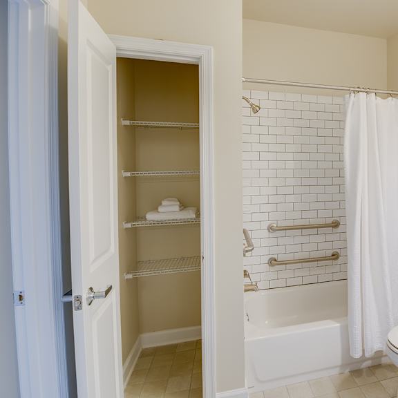 bathroom with linen closet