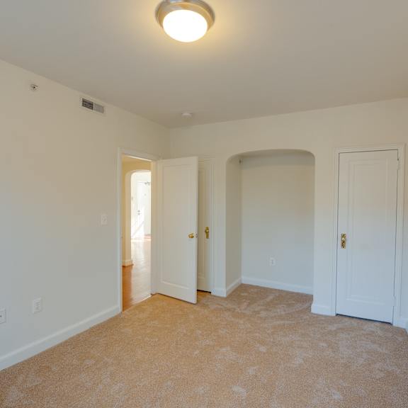 carpeted bedroom and closet
