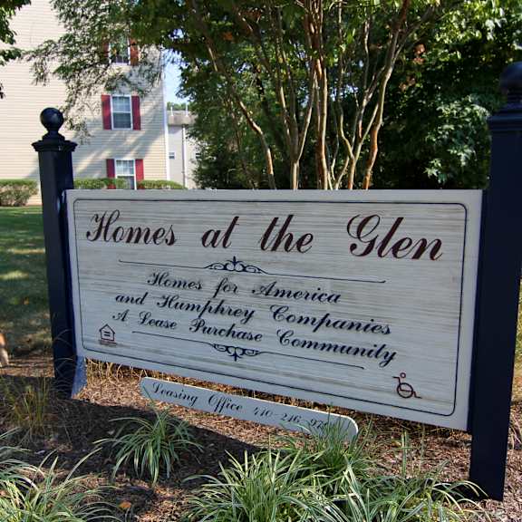 home at the glen sign in front of community