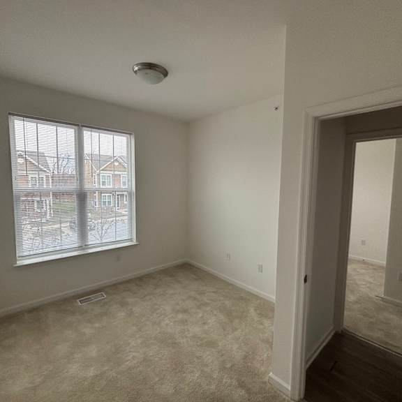 a room with a window and a door.