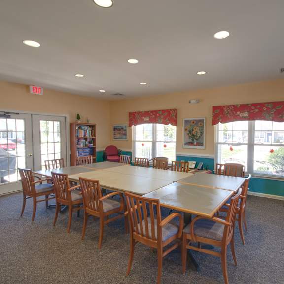 a large conference room with a long table and chairs.