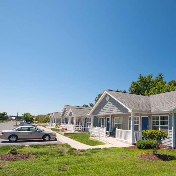 a car is parked in front of a house.