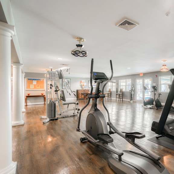 the gym is equipped with treadmills and other fitness equipment