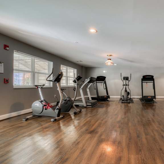 private gym with exercise equipment at the district flats apartments in lenexa