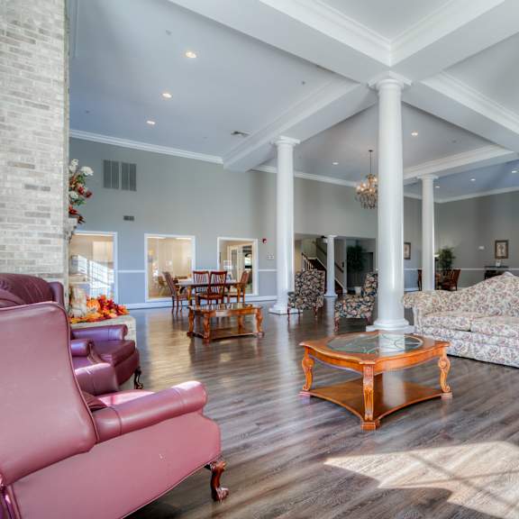 a large living room with couches and a table