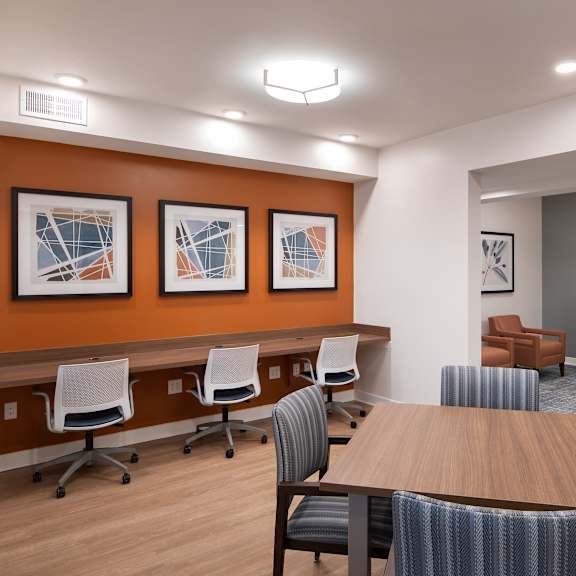a conference room with a table and chairs