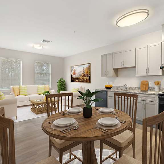 a modern kitchen with a dining table set for two.