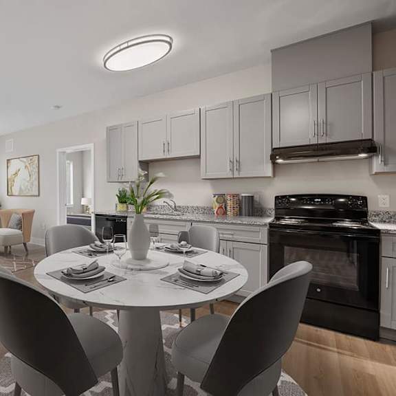 a modern kitchen with a dining table set for two.