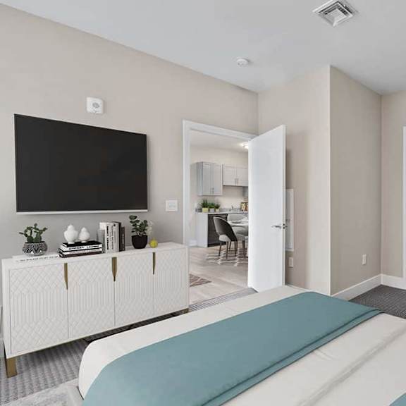 a bedroom with a bed, a television, and a cabinet.