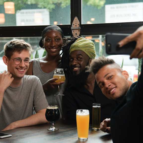 group of diverse friends taking a selfie
