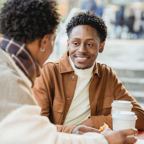 male smiling at friend