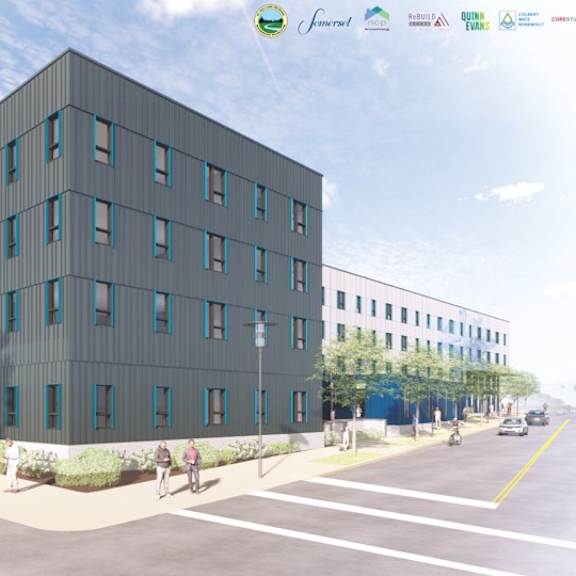 a modern building with a green awning is depicted in the image.