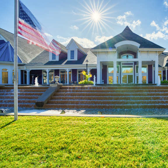 the front of a building flags in front of it