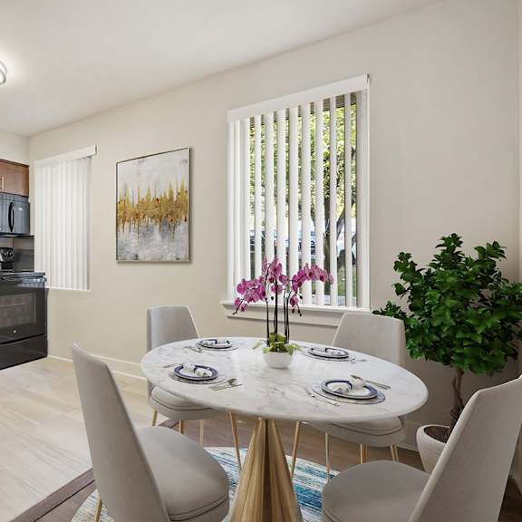a kitchen with a dining table set for six.