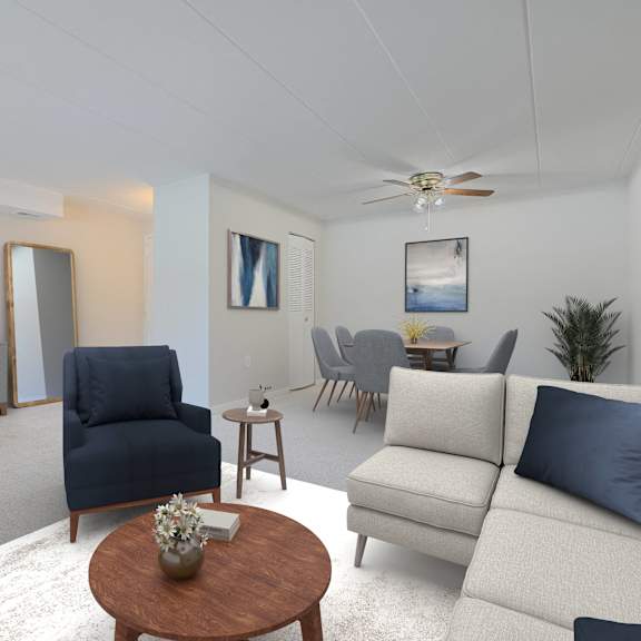 a living room with a blue chair and a white couch.