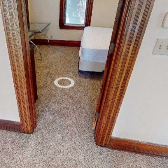 a small room with a bed and a window.