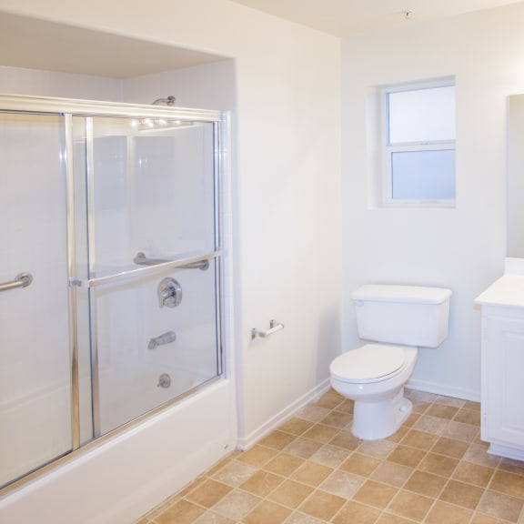 a bathroom with a shower toilet and sink at Dronfield Astoria Apartments, Sylmar, California, 91342