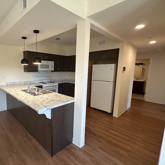 a view of a kitchen with a sink and a counter top