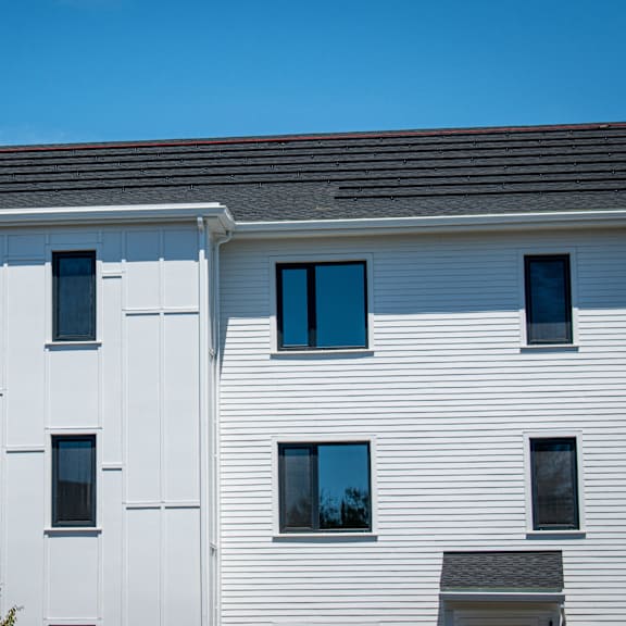 a white building with a blue sky in the background