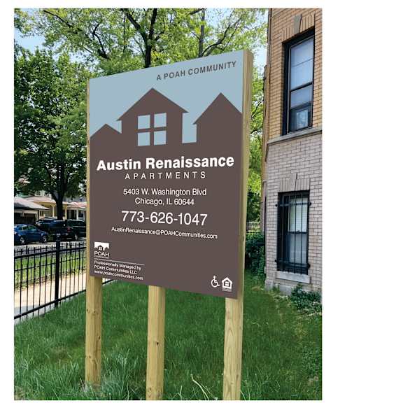 a real estate sign in front of a house photographic print
