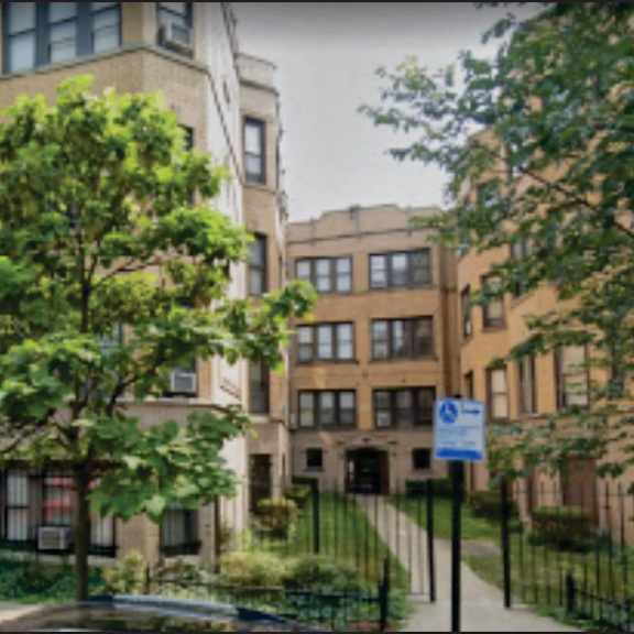 a tree in front of a building