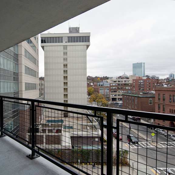 a balcony with a view of the city
