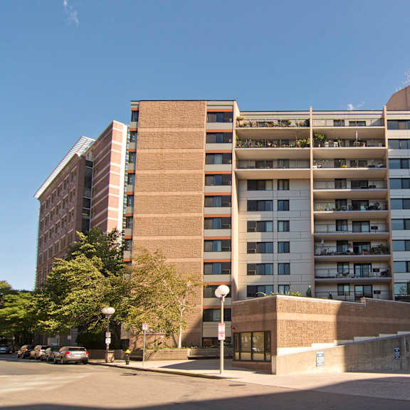an apartment building on the corner of a city street