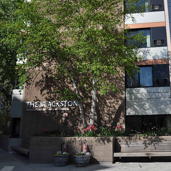 a building with a sign that reads the blossom on it