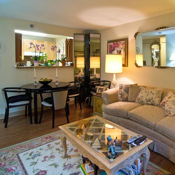 a living room and dining room with a couch and a table