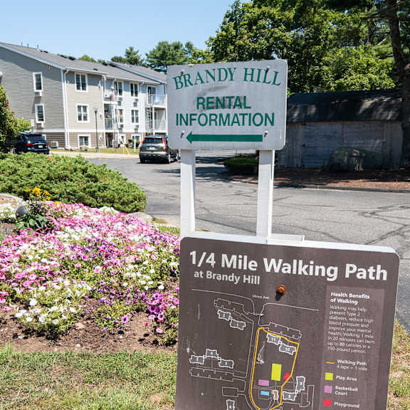a sign for brandy hill rental information and a 1/4 mile walking path.