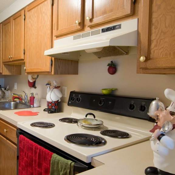 a kitchen with a stove and a refrigerator
