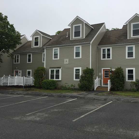 a row of houses in a parking lot
