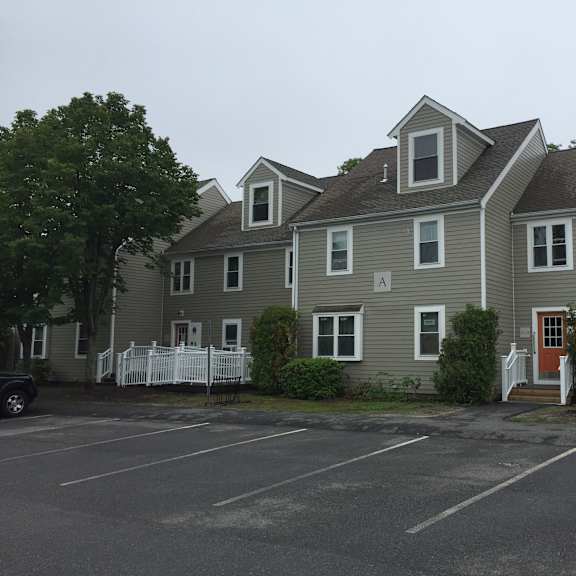 a row of houses in a parking lot