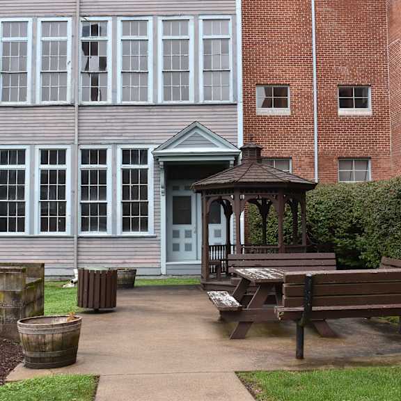a gazebo sitting in front of a building