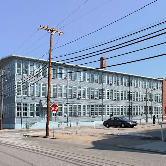 a large building with a car parked in front of it