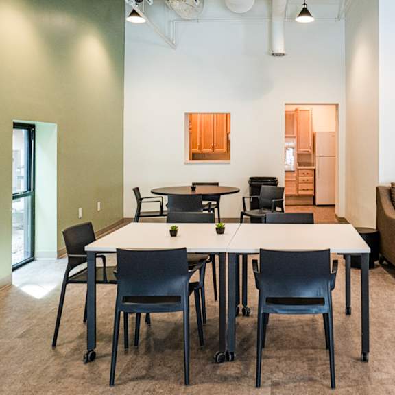 a conference room with a long table and chairs.