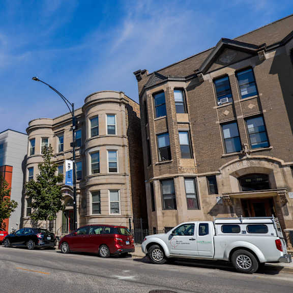 a street view with cars and buildings.