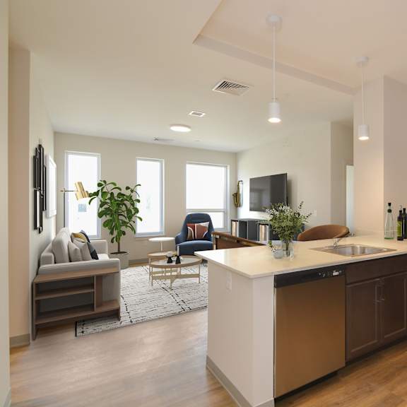 a modern kitchen with a large island and stainless steel appliances.