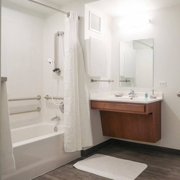 a bathroom with a toilet and a sink and a shower