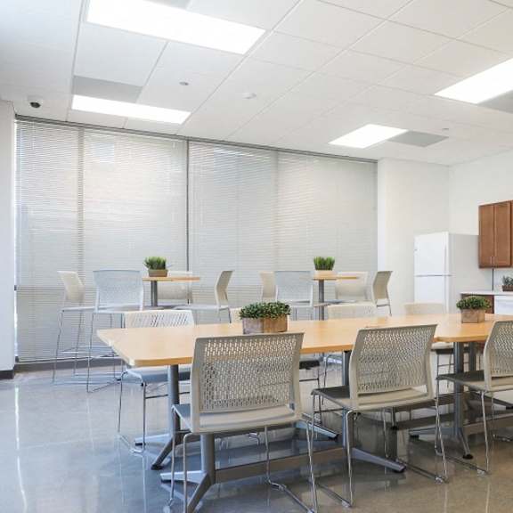 a conference room with a table and chairs
