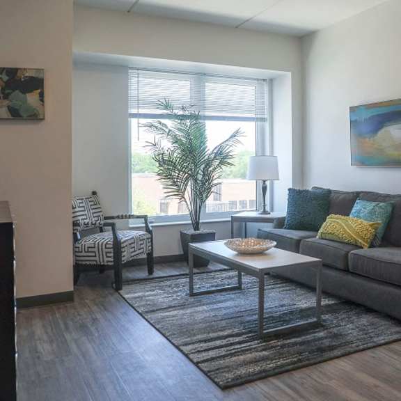 a living room with a couch and a table