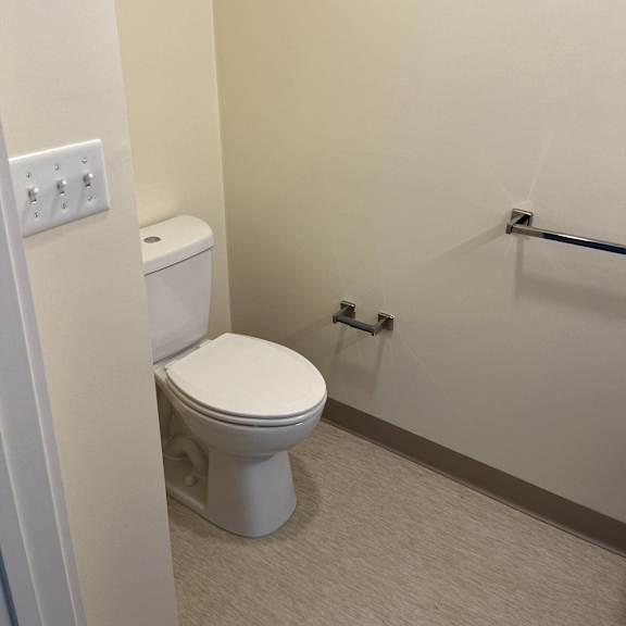 a small bathroom with a toilet and a shower