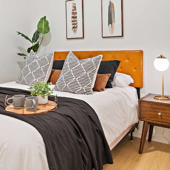 bedroom with bed and lamps at the freelon at sugar hill, detroit, mi 48201
