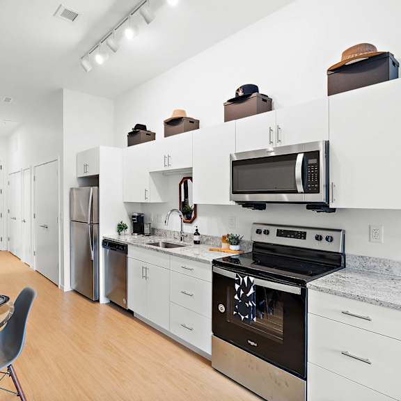 kitchen with appliances at the freelon at sugar hill, detroit, mi 48201