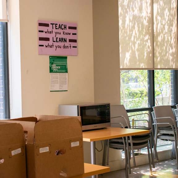 a room with cardboard boxes and a computer on a table